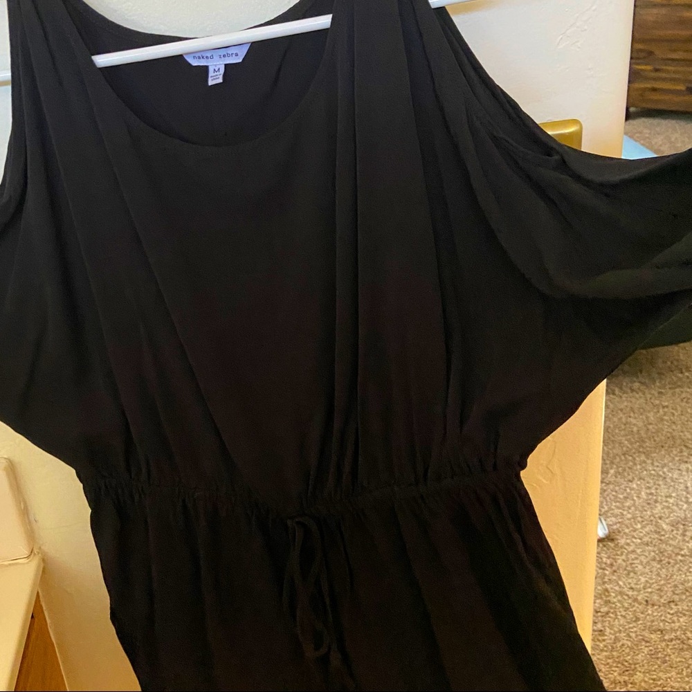 Black peek a boo shoulder top. Hardly worn.